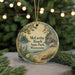 A round ornament with a scenic landscape of McCarty Beach, Minnesota, featuring pine trees, a lake, and a mountain.