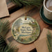 A decorative ornament with a scenic landscape of a lake, lighthouse, and pine trees, featuring the text "McLain State Park, Michigan".