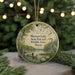 A round ornament with a painting of ducks and a bird in a natural setting, hanging on a string.