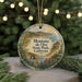 A decorative ornament featuring a scenic landscape of Montana de Oro State Park, California, with a string of lights in the background.