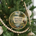 A round ornament hanging on a Christmas tree, featuring a scenic image of Moose Lake State Park, Minnesota.