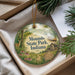 A decorative ornament with the text "Mounds State Park, Indiana" and an illustration of a forest and a cabin, hanging from a string.