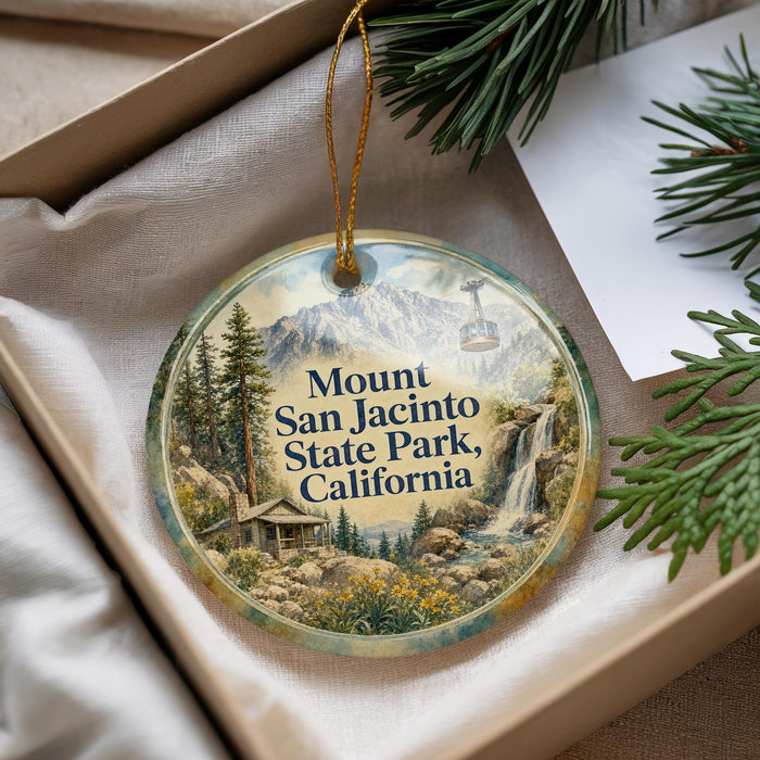 A decorative ornament with a scenic mountain landscape and a cabin, featuring the text "Mount San Jacinto State Park, California".