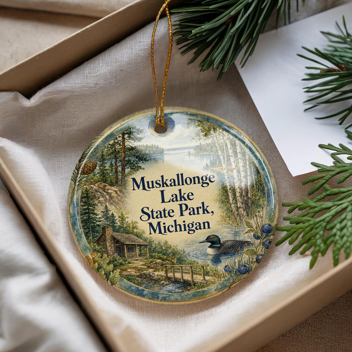 A round ornament with a scenic image of Muskallon Lake State Park, Michigan, hanging from a string.
