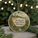 A circular ornament with a lighthouse and a scenic landscape, featuring the text "Muskegon State Park, Michigan" on it.