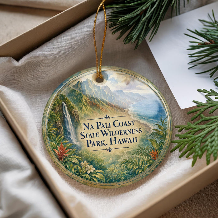 A decorative ornament with a scenic image of the Na Pali Coast State Wilderness Park in Hawaii, featuring lush greenery, a waterfall, and mountains.