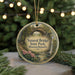 A round ornament with a scenic image of a natural bridge in a forest, surrounded by greenery and flowers, with the text "Natural Bridge State Park, Massachusetts" displayed on it.