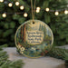 A round ornament with a scenic image of the Navarro River and Redwoods State Park in California, surrounded by pine branches and greenery.