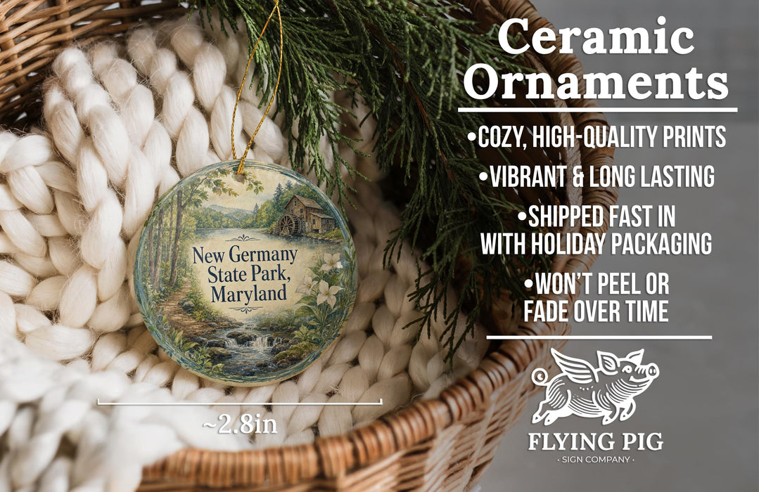 Ceramic ornaments, including a New Jersey State Park, Maryland ornament, are displayed in a basket with a pine branch.
