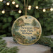 A round ornament with a scenic landscape of Newaygo State Park, Michigan, featuring a lake, a bridge, and a bird in flight.