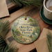 A round ornament with a scenic image of the Olta River State Park in Florida, featuring a bird, a boat, and a bridge.
