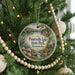 A round ornament hanging on a Christmas tree, featuring a scenic image of Paintsville Lake State Park, Kentucky.