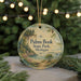 A round ornament with a scenic landscape of a lake, mountains, and pine trees, featuring the text "Palms Book State Park, Michigan" on it.