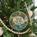 A round ornament hanging on a Christmas tree, featuring a peacock and the text "Peacock Springs State Park, Florida".