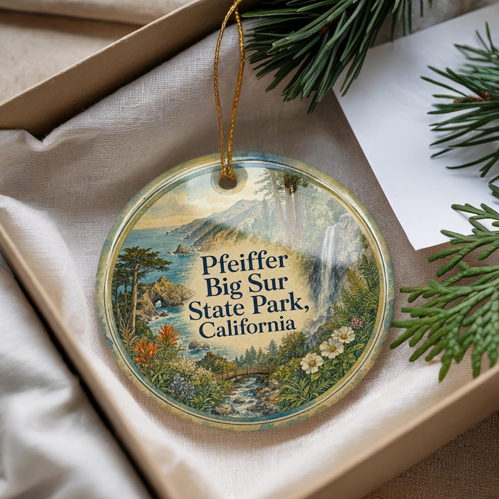A decorative ornament with a scenic landscape of Pfeiffer Big Sur State Park, California, hanging from a string.