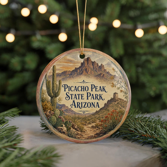 A circular ornament featuring a desert landscape with a cactus and mountains, with the text "Picacho Peak State Park, Arizona" prominently displayed.