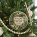 A round ornament hanging on a Christmas tree, featuring a scenic image of Pickett's Mill Battlefield State Park, Georgia.