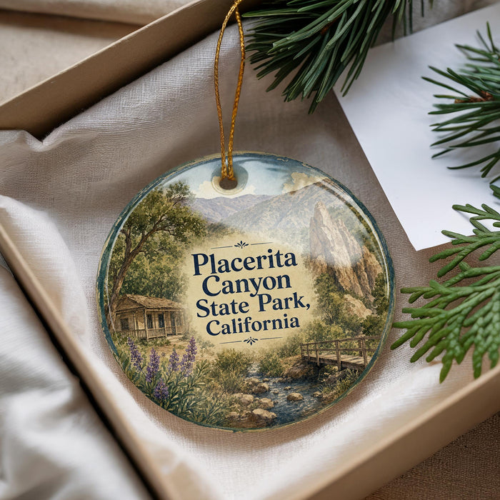 A decorative ornament with a scenic image of Placerita Canyon State Park, California, hanging from a string.