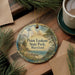 A round ornament with a lighthouse and a scenic landscape, featuring the text "Point Lookout State Park, Maryland".
