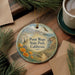 A decorative ornament with a scenic image of Point Mugu State Park, California, featuring a bird, flowers, and a path.