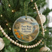 A round ornament hanging on a Christmas tree, featuring a scenic image of Point Mugu State Park, California.