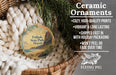 Ceramic ornaments, including a round ornament with a tropical beach scene, are displayed in a woven basket.