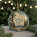 A round ornament with a scenic landscape of Ponderosa State Park, Idaho, featuring a cabin, pine trees, and a lake.