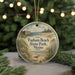 A circular ornament featuring an illustration of Popham Beach State Park in Maine, with a bird and a beach scene.