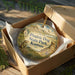 A decorative ornament in a box, featuring a prairie dog and the text "Prairie Dog State Park, Kansas".