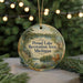 A round ornament with a scenic lake and forest landscape, featuring the text "Proud Lake Recreation Area, Michigan" on it.