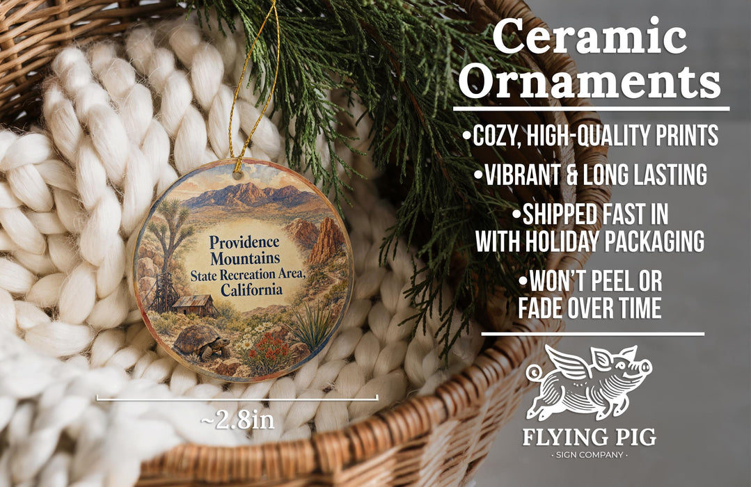 Ceramic ornaments, featuring a design of a mountain landscape with a pine tree, are displayed in a woven basket.