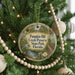 A Christmas tree decorated with ornaments, including a round ornament with the text "Pumpkin Hill Creek Preserve State Park, Florida" on it.