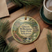 A round ornament with a scenic image of Queen Wilhelm State Park, Arkansas, hanging on a wooden surface.