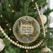 A Christmas tree decorated with ornaments, including a round ornament with a scenic image of Rifle Falls State Park, Colorado.