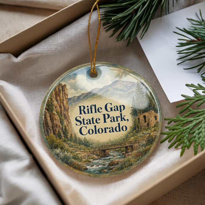 A decorative ornament with a scenic image of Rifle Gap State Park, Colorado, hanging from a string.