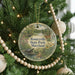A round ornament hanging on a Christmas tree, featuring a scenic image of Rosaryville State Park, Maryland.