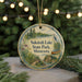 A circular ornament with a scenic landscape of Sakatah Lake State Park, Minnesota, featuring a bird, trees, and a canoe.