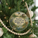 A round ornament hanging on a Christmas tree, featuring an illustration of a bird, a deer, and a birdhouse, with text that reads "Sam Parr State Fish and Wildlife Area, Illinois".