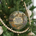 A round ornament hanging on a Christmas tree, featuring a scenic illustration of San Juan Bautista State Historic Park, California.