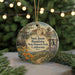 A round ornament with a painting of Santa Juan Bautista State Historic Park, California, featuring a bell tower, a church, and a field with flowers.