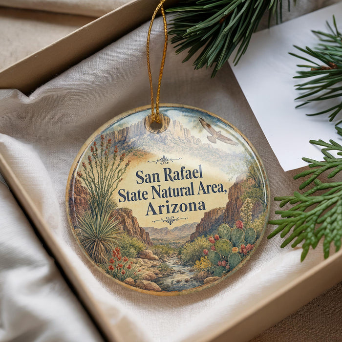 A decorative ornament with a scenic landscape of mountains, desert, and desert plants, featuring the text "San Rafael State Natural Area, Arizona" on it.