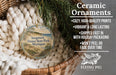 Ceramic ornaments, specifically a ceramic ornament with a scenic image of Saugatuck Dunes State Park, Michigan, hanging from a wicker basket.