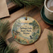 A decorative ornament with a scenic lake landscape and pine trees, featuring the text " Sebago Lake State Park, Maine" on it.