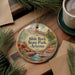 A decorative ornament featuring a scenic landscape of Slide Rock State Park, Arizona, with a waterfall and mountains in the background.
