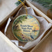 A decorative ornament in a box, featuring a serene landscape with a lighthouse, a bird, and flowers, along with the text "South Shore State Park, Illinois".