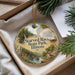 A decorative ornament with a scenic landscape of Starved Rock State Park, Illinois, featuring a waterfall, pine trees, and a bird.