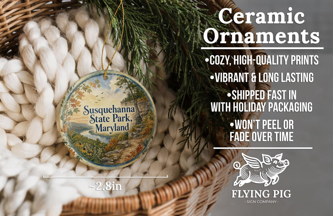 Ceramic ornaments, including a round ornament with a scenic landscape of Susquehanna State Park, Maryland, hanging from a wicker basket.