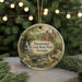 A round ornament with a painting of Sweetwater Creek State Park, Georgia, featuring a bird perched on a branch and a waterfall in the background.