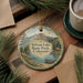 A round ornament with a scenic image of Sylvan Lake State Park, Colorado, hanging on a wooden surface.