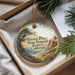 A round ornament with a scenic landscape of Torrey Pines State Natural Reserve, California, hanging from a string.